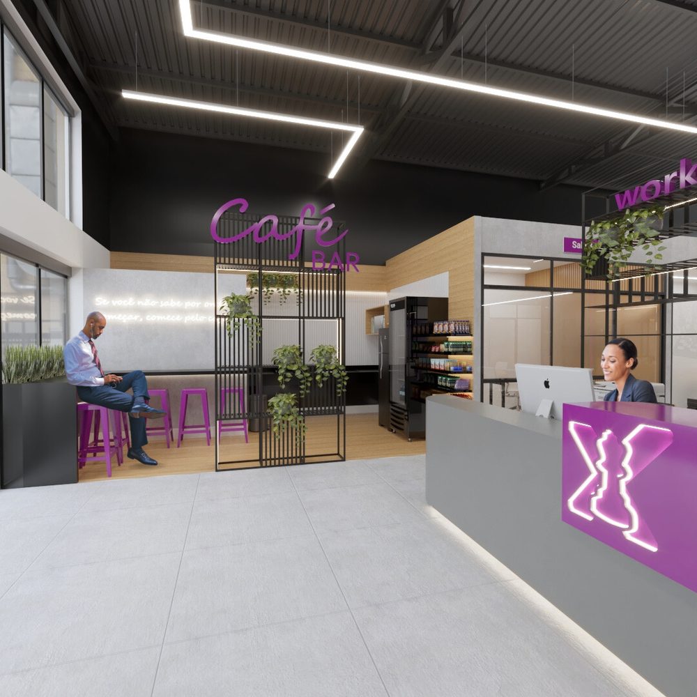 Recepção do coworking: balcão cinza com o X da marca em neon roxo, atendente ao computador e, ao fundo, um café bar com banquetas onde uma pessoa trabalha